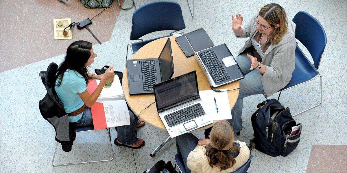 AACC students discuss their studies in the CALT atrium.